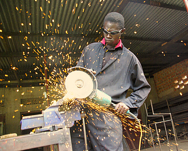 man holds green corded circular saw thumbnail