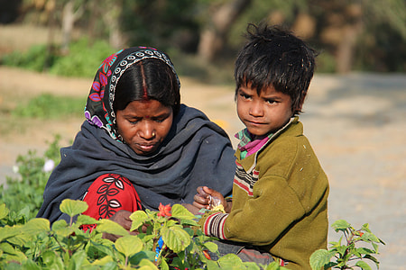 woman and toddler near plant thumbnail