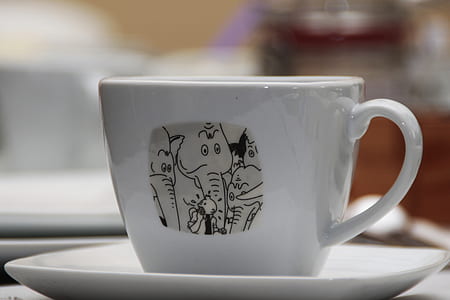 white and gray ceramic teacup on saucer close-up photography thumbnail