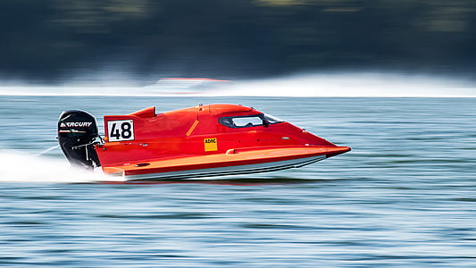 time lapse photography of red powerboat thumbnail