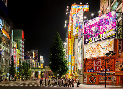 people near tree and billboards thumbnail