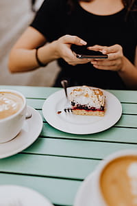 Drinking coffee and eating cake in a cafeteria thumbnail