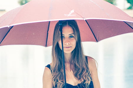 woman holding red umbrella thumbnail