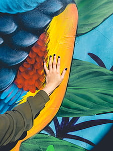 woman touching graffiti thumbnail