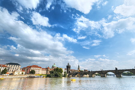 Brown and White Building Under Blue and White Cumulus Clouds during Daytime thumbnail