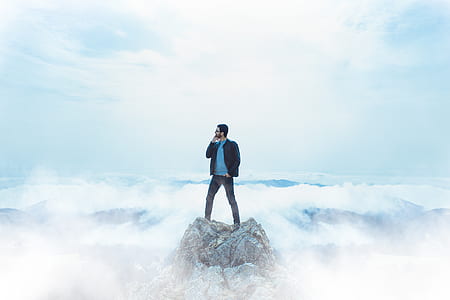 man standing on top of mountain thumbnail