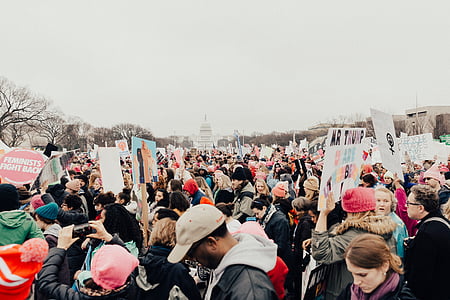 people gathering in front of white structure thumbnail