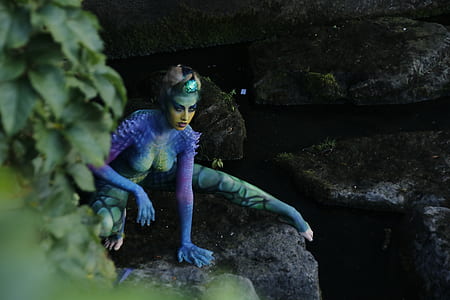 woman character on gray rock thumbnail