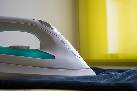 close-up photo of white and teal clothes steam iron thumbnail