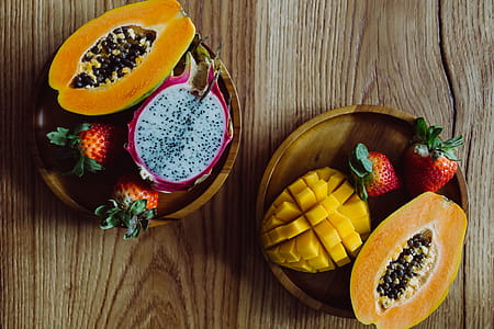 Exotic fruits on a wooden table thumbnail