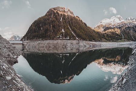 body of water near mountain thumbnail