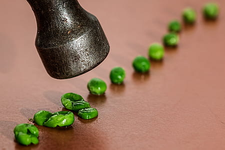 lined green peas on brown surface thumbnail
