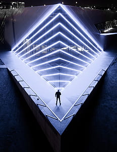 silhouette of person standing in front of light thumbnail