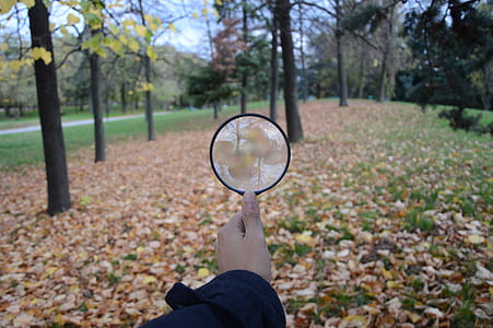 person holding lens thumbnail