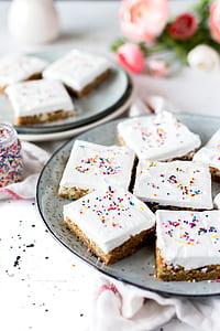 slice of bite-size cakes on ceramic plates thumbnail
