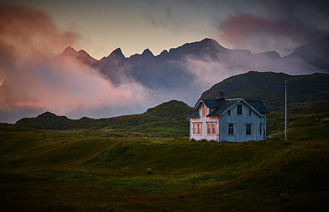 white wooden house in the middle of the valley thumbnail