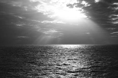 time lapse photography of body of water with sun ray thumbnail