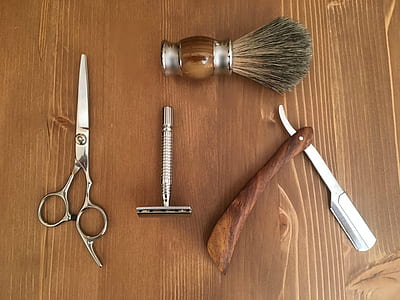 brown and silver grooming kit on brown wooden surface thumbnail