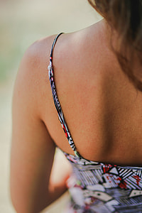 Woman in a dress with a camera thumbnail