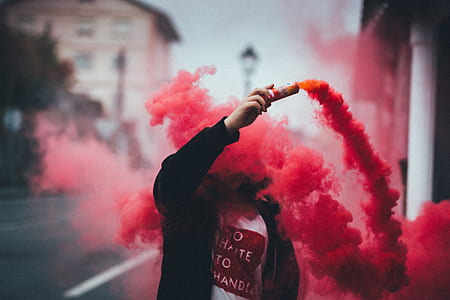 man holding can with red smoke thumbnail