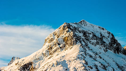 Snow Covered Mountain Under Clear Blue Sky thumbnail
