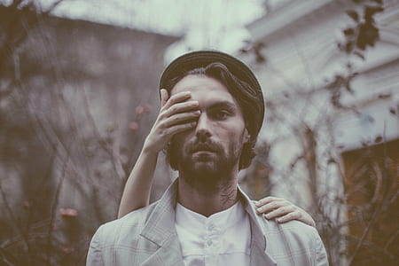 person holding mans eye thumbnail