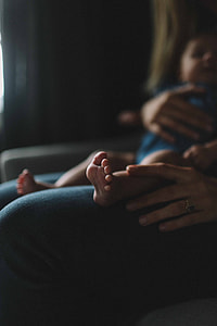 woman holding baby on her lap thumbnail