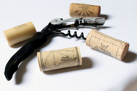 black and gray steel corkscrew on white surface thumbnail