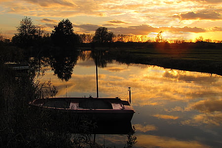 brown boat on body of water thumbnail
