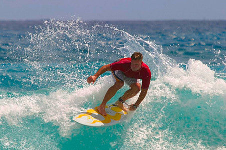 man riding on surfboard during daytime thumbnail