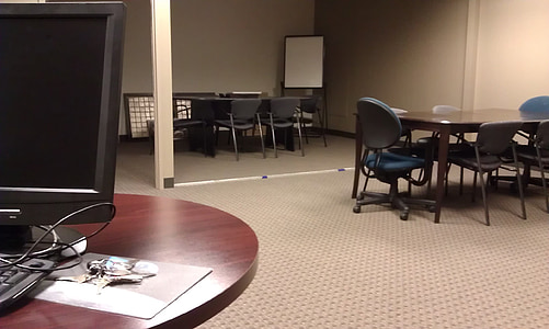 photo of rectangular black wooden table with chairs inside room thumbnail