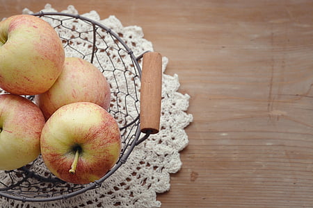 apples on gray basket thumbnail