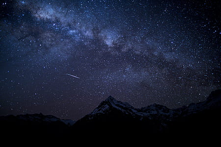 black and white mountain under stars at night thumbnail