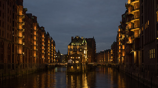 low-angle photography of buildings near body of water thumbnail