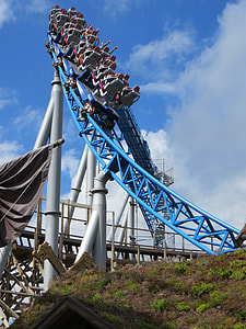 group of people riding on roller coaster during daytime thumbnail