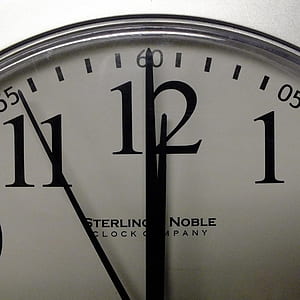 white and black Sterling Noble analog clock thumbnail