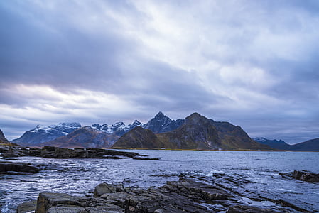 body of water near mountain ranges thumbnail