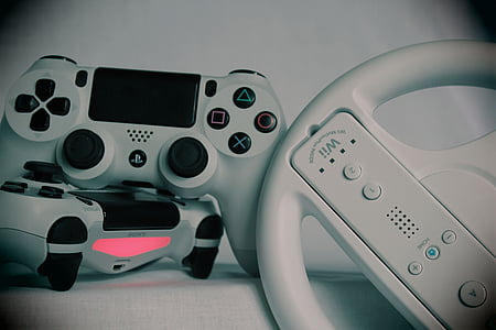 Nintendo Wii controller and Sony PS4 Dual Shock controllers thumbnail