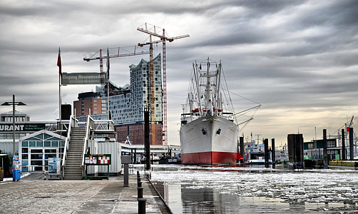 gray and red ship at cloudy sky thumbnail