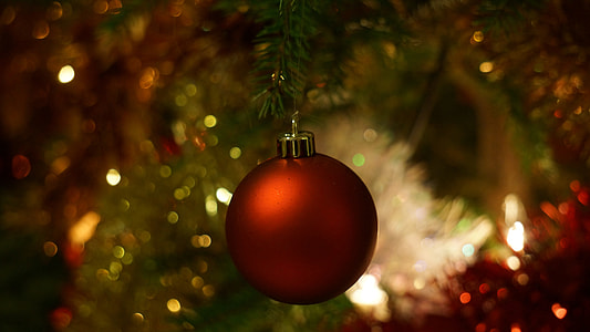 red Christmas bauble in blur lens photography thumbnail