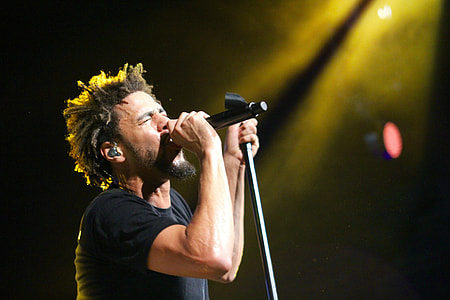 man singing on stage thumbnail