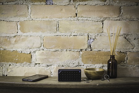 black smartphone on desk thumbnail