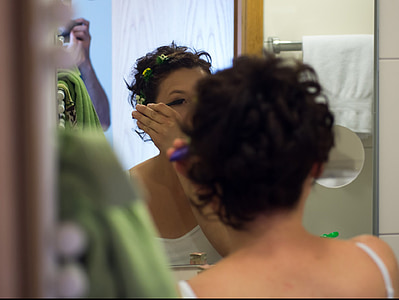 woman facing in front of mirror thumbnail