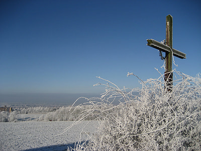 low angle photography of brown cross thumbnail