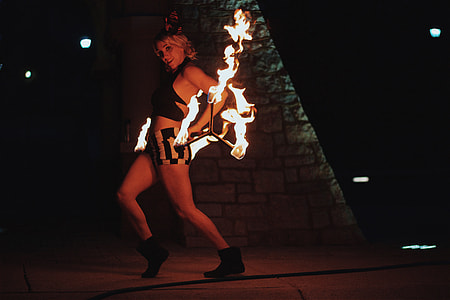 woman dancing and playing with fire thumbnail