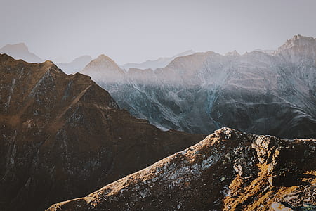 photo of mountain peak under white sky thumbnail
