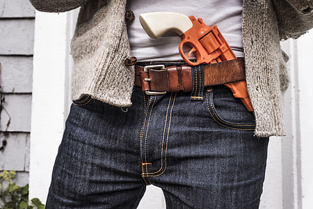white and brown revolver on belt thumbnail