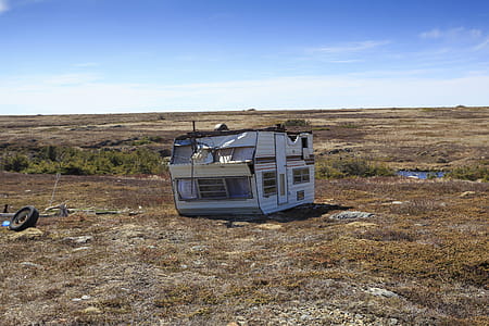 Old caravan trailer over turned and damaged. thumbnail
