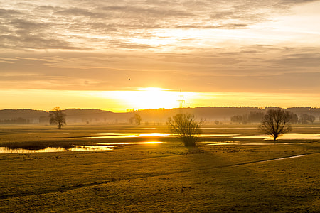 landscape photography of grass field under golden hour thumbnail