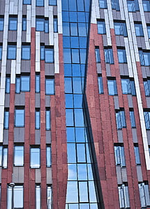 close up photo of brown and blue high-rise building thumbnail